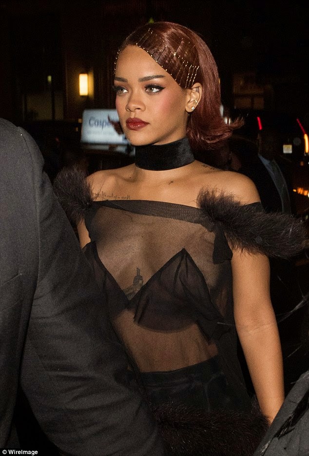 Photos: Rihanna suffers nip-slip as she goes braless in sheer top.